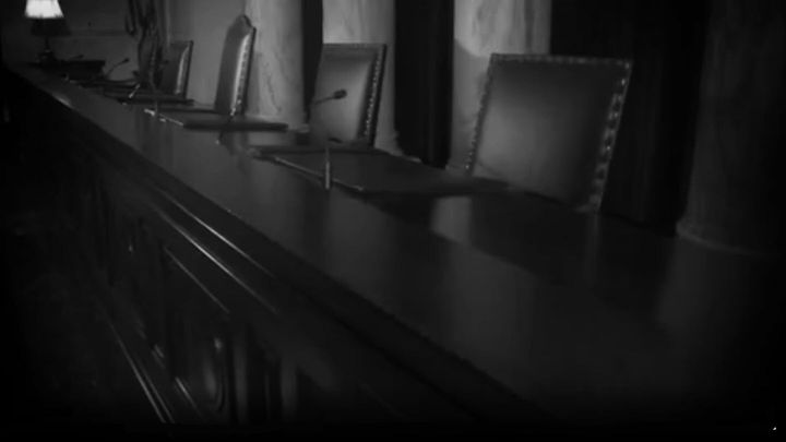 Still of court bench from RSLC ad